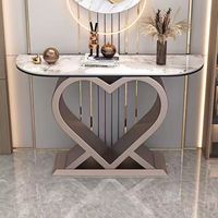 Table console de luxe avec base en métal doré brillant et plateau en pierre frittée, design cœur d'amour, pour salon, entrée