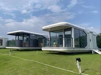 Maison capsule spatiale en structure acier de design moderne, maison préfabriquée en conteneur, hôtel de luxe, mini-maison, maison modulaire mobile