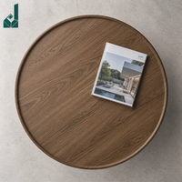 Table ronde moderne de luxe en bois grainé avec piétement unique en métal blanc, idéale pour bureau privé ou réception commerciale