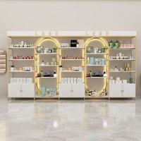 Vitrine de présentation cosmétique de luxe légère avec cadre doré, multi-niveaux, carrée, rétroéclairée par LED, robuste, étanche et recyclable pour salon et commerce de détail