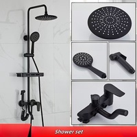 Colonne de douche économique noire mate avec pommeau de douche effet pluie, ensemble de douche moderne en laiton à quatre fonctions avec rangement