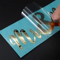 Étiquettes transparentes imperméables imprimées en 3D de luxe autocollants personnalisés en métal avec logo en feuille d'or autocollant de transfert UV en argent chaud pour l'emballage