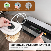 Machine de mise sous vide électrique portable en acier inoxydable pour l'emballage alimentaire avec couvercle à ouverture et fermeture automatiques, support de rouleau et minuteur.
