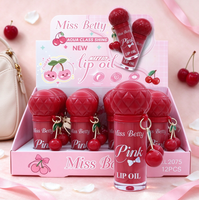 Vente en gros d'huile à lèvres rose très prisée avec breloque cerise, ensemble de porte-clés huile à lèvres portable mignon, style cerise, coffret cadeau pour le soin quotidien des lèvres