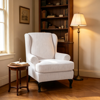 Fauteuil d'appoint moderne à dossier haut en velours côtelé gaufré crème, avec pieds en métal noir courbés, pour salon