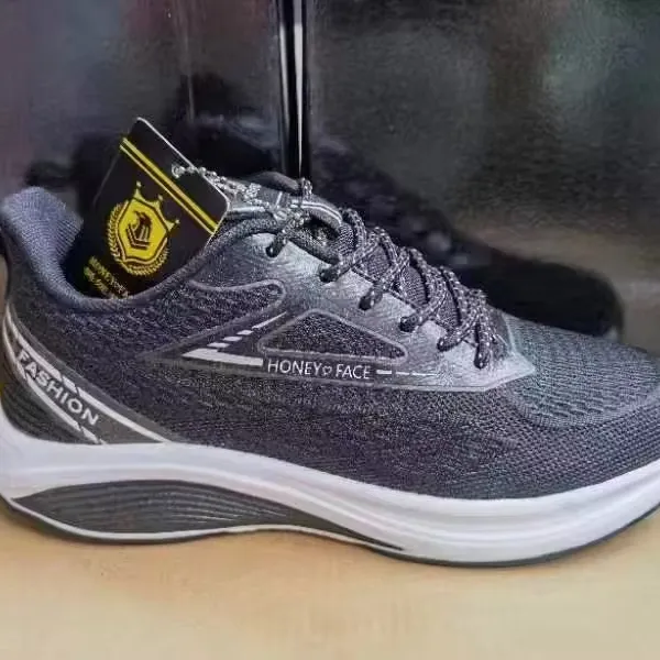 Scarpe da uomo di grandi dimensioni traspiranti con tessuto a mosca scarpe coreane di tendenza linea con fondo popcorn da corsa sportive casual