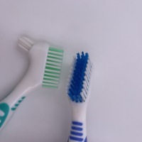 Cepillo de dientes de doble cara de alta calidad para dentaduras excelente herramienta de cuidado bucal