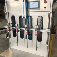 Machine de remplissage à gravité à deux étages anti-éclaboussures pour liquides à forte formation de mousse