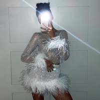 Mini jupe Sexy de fête pour femmes, robe en maille avec plumes d'autruche et strass élastique