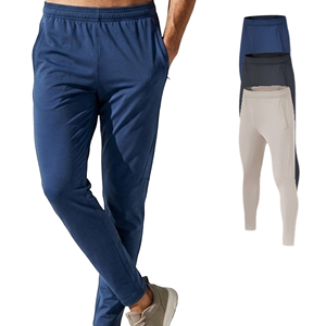 กางเกงวอร์มผู้ชายพรีเมียมคุณภาพสูง ผลิตจากโพลีเอสเตอร์ผสมสแปนเด็กซ์ ทรงสลิมฟิต ขาเรียว เหมาะสำหรับออกกำลังกาย ฟิตเนส วิ่ง และเล่นกีฬา - Product Image 1