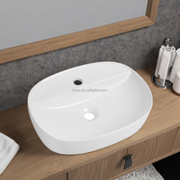 Vente en gros de lavabo en céramique au design moderne articles sanitaires durables égouttoir pour évier de salle de bain à montage sur table situations multiples