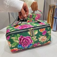 Trousse de maquillage élégante à fleurs Pochette à cosmétiques en cuir PU personnalisée de luxe pour les femmes Voyage en plein air avec poignée Trousse à maquillage florale