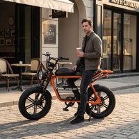 Vélo électrique élégant à gros pneus avec freins à disque de qualité supérieure, vélo de banlieue électrique orange pour les trajets urbains quotidiens