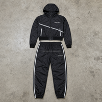 Ensemble décontracté pour homme personnalisé, sweat à capuche noir à fermeture éclair avec poches à rayures diagonales, pantalon de jogging à rayures latérales, OEM ODM