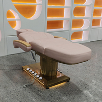 Table de massage électrique de luxe pour spa facial et esthétique, avec base dorée, commande au pied et 3 moteurs, incluant tabouret