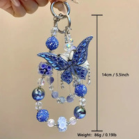 Breloque de téléphone papillon bleu foncé avec gros strass et perles, lanière de poignet pour sac, bijou artisanal lourd, cadeau pour femme