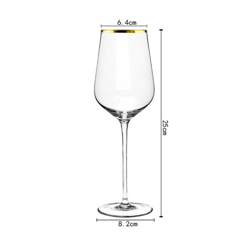 Gold rimmed red wine glass