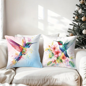Des colibris et des fleurs aux couleurs vives ornent des coussins douillets dans un décor festif. - Product Image 3