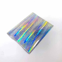 Rouleau de film laser haute sécurité auto-adhésif, personnalisé, laminé thermiquement, en BOPP souple, holographique transparent/argenté, résistant à l'humidité