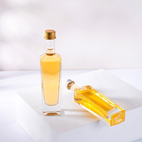 Bouteilles en verre transparentes de 50 ml de qualité supérieure pour l'emballage de la vodka et du whisky, vente en gros dans une boîte personnalisée