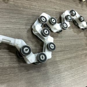 Suku Cadang Eskalator Desain Modern Berkualitas Tinggi Tahan Lama Rantai Putar (Plastik + Logam) untuk Penggunaan Komersial & Residensial - Product Image 2