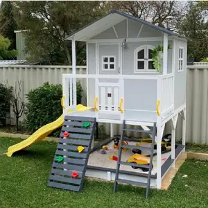 Outdoor home yard wooden play house tree house with slide rock wall and sand pit