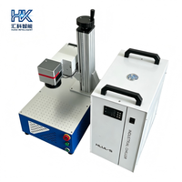 Machine de marquage laser UV de bureau Huike 5W, idéale pour la gravure d'étiquettes sur les flacons cosmétiques en verre et les articles en verre.