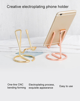 Support de téléphone portable étanche au design moderne créatif et décoratif en métal paresseux et support de tablette plat pour bureau