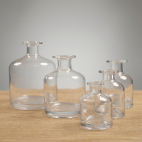 Diffuseur d'arômes cylindrique en verre blanc transparent à col long pour la maison, avec bouchon, bâtonnets en rotin et fleurs séchées, sans flamme