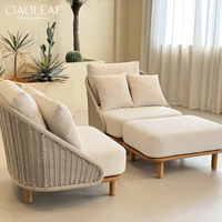 Fauteuil d'extérieur moderne avec coussins et dossier tressé pour patio et villa