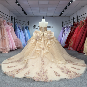 Elegante Vestido de Quinceañera Color Champán con Cristales y Hombros Descubiertos, con Lazo Grande - Product Image 4