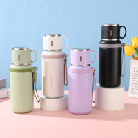Bouteille isotherme en acier inoxydable à double compartiment pour eau et thé, avec couvercle, design 2-en-1, sangle de transport, idéale pour les déplacements – Vente chaude