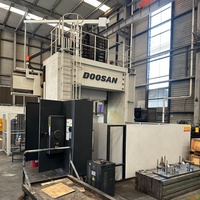 Centre d'usinage à 5 axes de type portique Doosan DCM-2740U coréen disponible à la vente