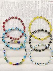 Bracciale Unisex in Cristallo Fatto a Mano Stile Bohemien Placcato Oro con Perline, Occhi di Nazar e Design Multicolore - Product Image 1