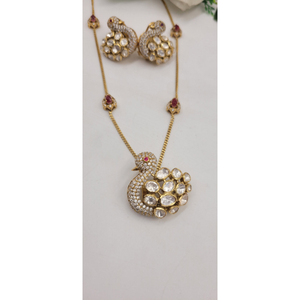 Ensemble de bijoux plaqué or de luxe comprenant un collier et des boucles d'oreilles pendantes assorties, ornées de diamants américains blancs et de pierres rouges. - Product Image 1