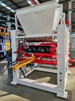 Machine de moulage de briques de pavage de route entièrement automatique QT10-15 avec système de plateforme hydraulique pour le béton et le moulage de bordures motorisées