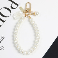 Perles alliage perlé porte-clés pour femmes nouveau sac de voiture minimaliste Bluetooth casque porte-clés pendentif bijoux en gros