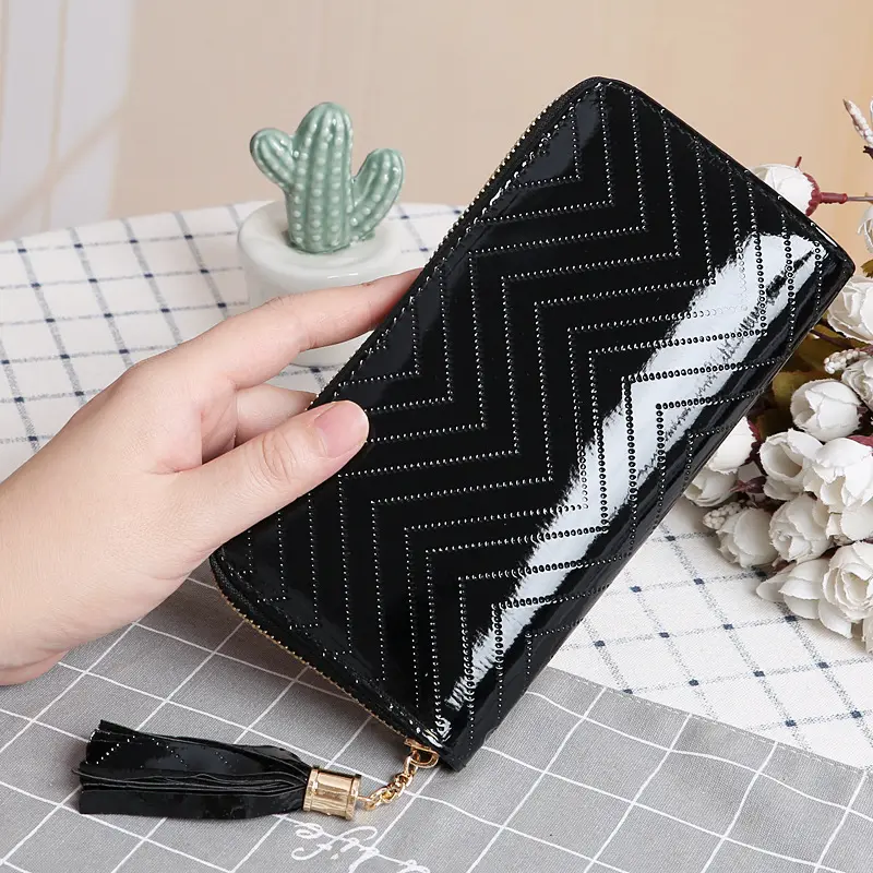 Venta al por mayor PU monedero mujeres bolso de mano textura en zigzag moda mujer billetera con borlas