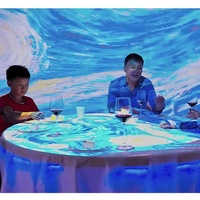 Mesa de juegos interactiva 3D redonda para niños, máquina digital eléctrica todo en uno para juegos de proyección de vídeo gestual en restaurante