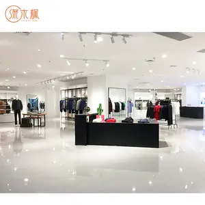 Présentoir de magasin de vêtements vernis de comptoir moderne avec lumière LED pour vitrine de comptoir de vêtements
