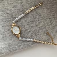 Montre française à petit cadran elliptique avec chaîne en perles naturelles, montre d'affaires, montre tendance pour femmes