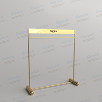 Kainice Porte-vêtements sur pied en acier inoxydable doré brillant personnalisé moderne Boutique de vêtements présentoirs pour robes