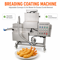 Machine à paner industrielle pour la production de nuggets de poulet frit sur une ligne de production dans une usine de transformation d'aliments surgelés