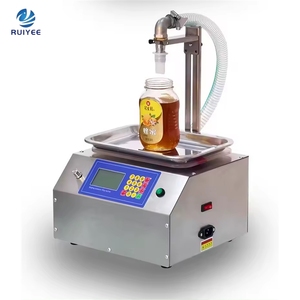 Máquina de llenado automática pequeña de sobremesa para miel, <span class=keywords><strong>leche</strong></span> líquida, aceite comestible y pasta de sésamo en botellas pulverizadoras - Product Image 1