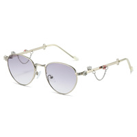 Lunettes de soleil rétro ovales en métal pour femmes, branches ornées de cristaux, protection UV400, élégantes, vente en gros, logo personnalisé