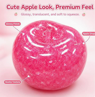 Jouet anti-stress souple et moelleux en forme de pomme translucide brillante à remontée lente
