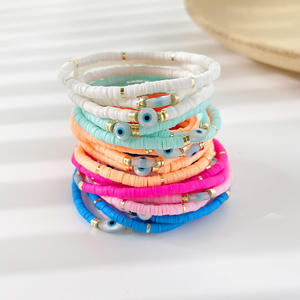 Bracelet ajustable en perles d'argile bohèmes faites à la main avec breloque œil de diable en coquillage pour homme, marque Quake - Product Image 1