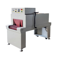 Machine d'emballage semi-automatique pour cigarettes avec tunnel de film rétractable pour paquets