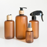 Botella de Plástico PET Ámbar Esmerilado de 60ml, 120ml, 250ml, 500ml con Bomba Dosificadora y Tapa de Bambú para Champú y Acondicionador