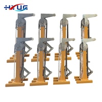 Système de levage hydraulique pour conteneurs maritimes avec vérins de stabilisation mobiles